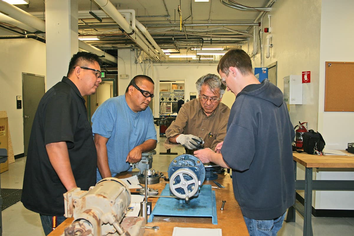 Students watch closely as instructor does a demonstration with some of the IMM equipment.