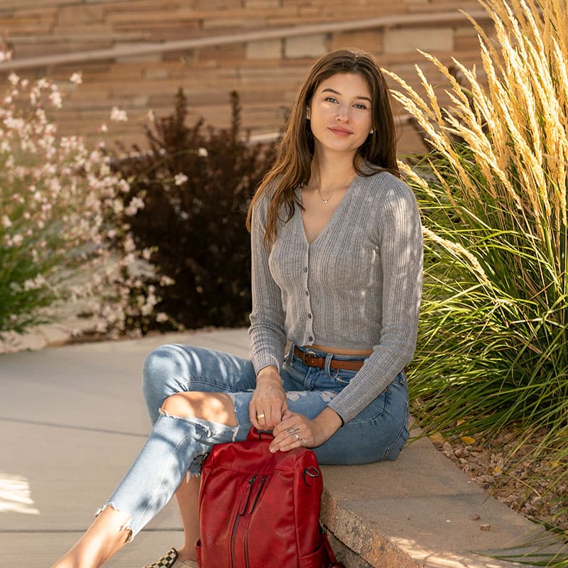 San Juan College student sitting down.