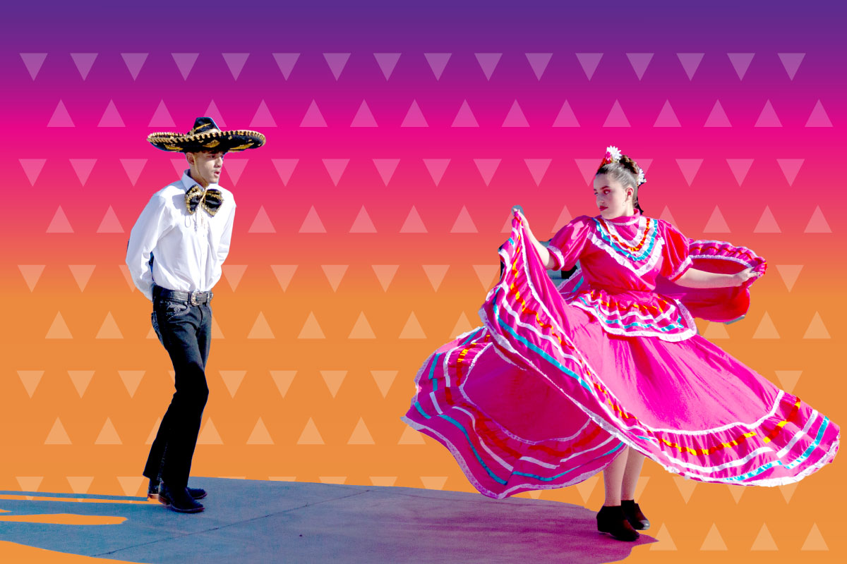 Two individuals in their traditional attire dancing with a bright vibrant sunset colors of purple, pink and orange in the background