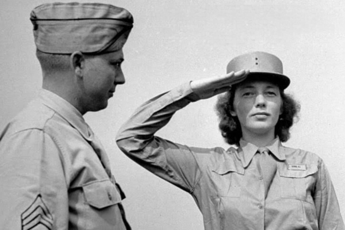 Two country's servicemen, one man on the left in his uniform and a women in salute on the right