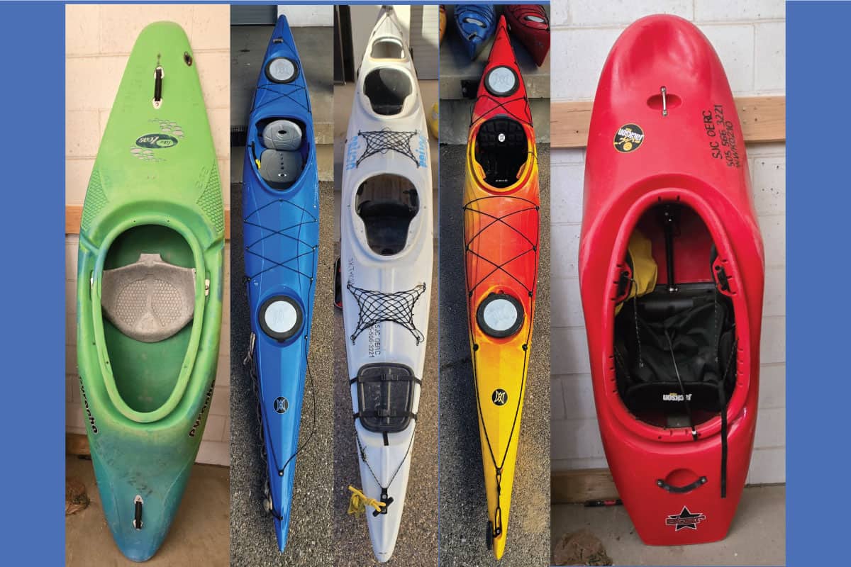 Group of five canoes and kayaks in green, blue, white, orange and red from the SJC HHPC ready for the auction!