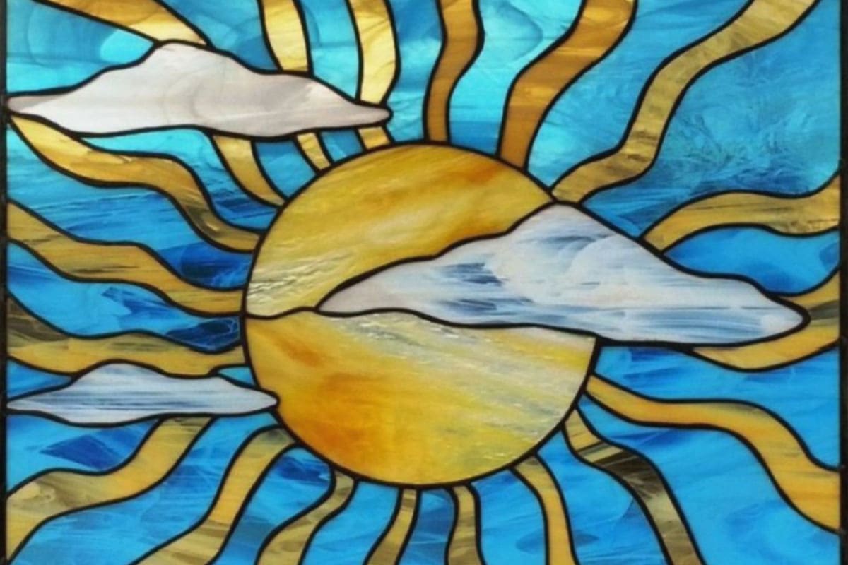 SJC Encore Student stained glass piece of a sun through clouds