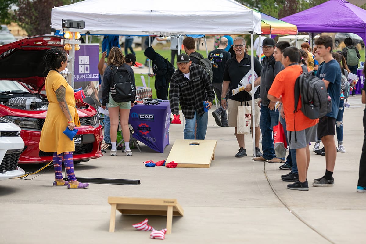 Large group of SJC students playing cornhole during student rush