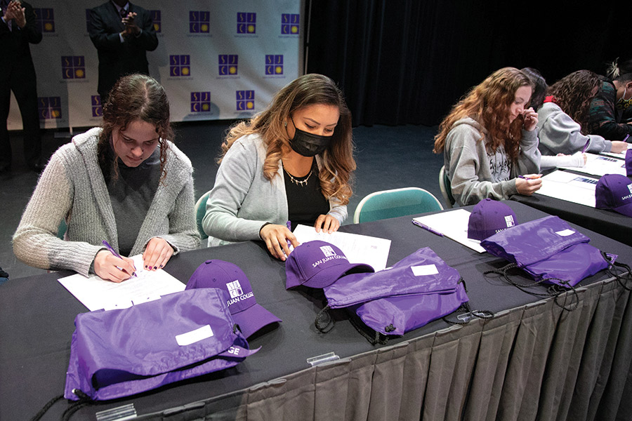 Students are seen signing letters of intent at last year's event in the Connie Gotsch Theatre.