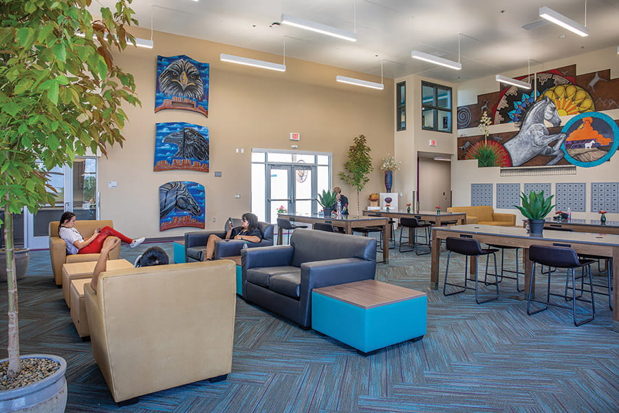 Students relax in the main lounge area at Nizhoni Sunrise Suites.