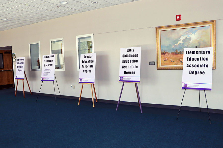 Signage promoting the TeachUp program event is seen in the hallway of the Henderson Fine Arts Center.