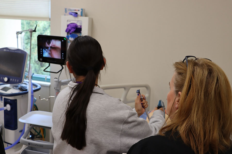 A student using equipment in the SJC Health Science lab