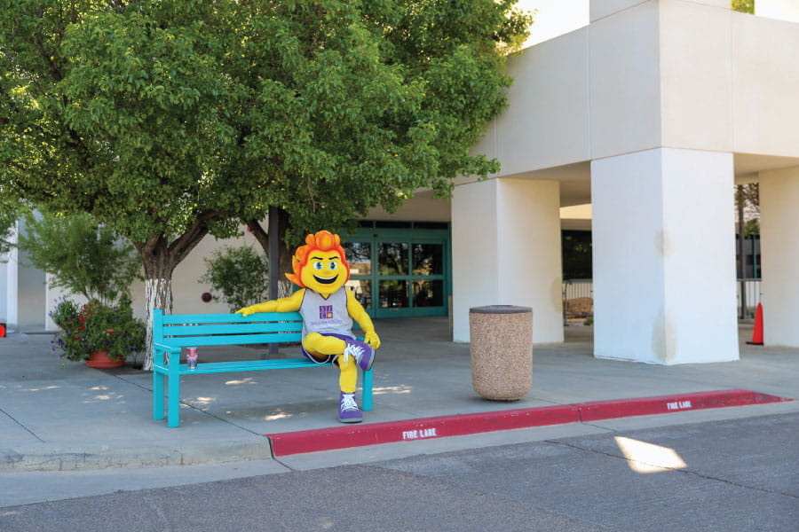 SJC Mascot Blaze sitting on bench