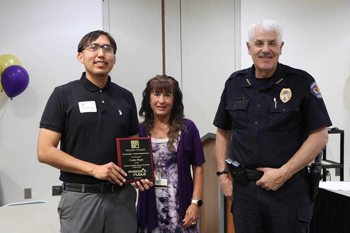 Criminal Justice Honors Student with Police Cheif Hebbe and teacher.
