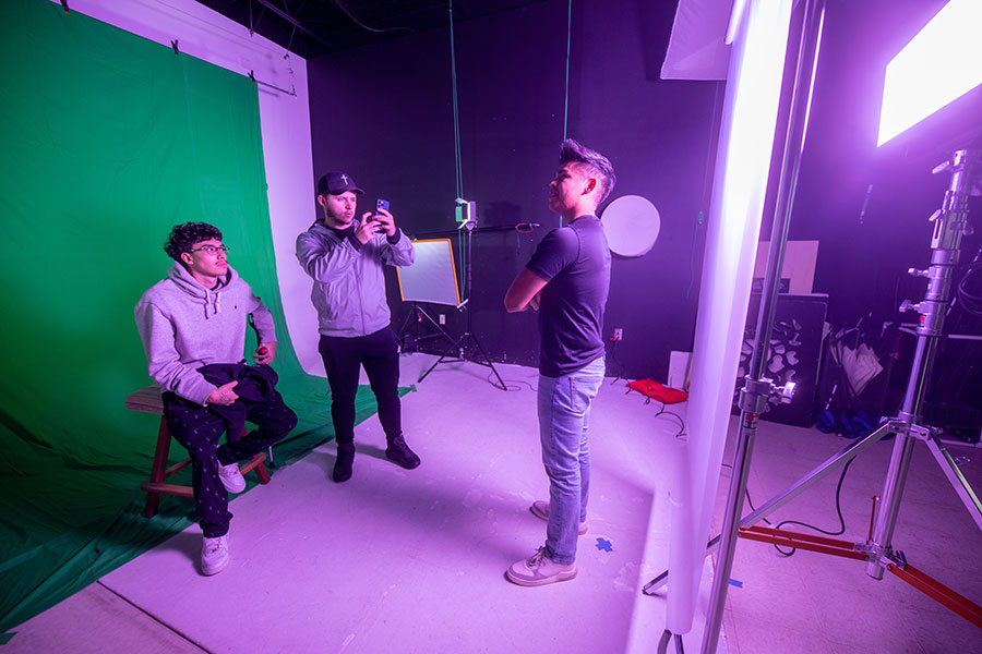 Group of San Juan College students in the DMAD program utilizing lighting equipment