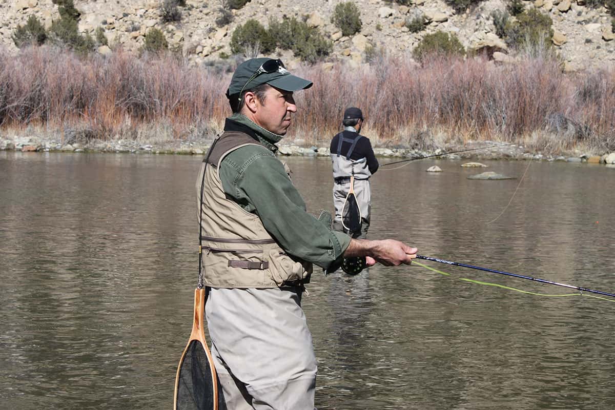Community Learning Center student fishing in the San Juan River