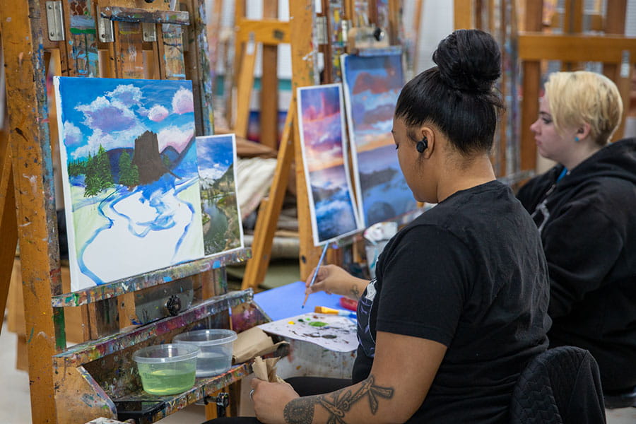 San Juan College students painting landscapes
