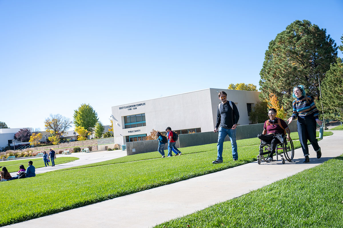 students on campus in learning commons area