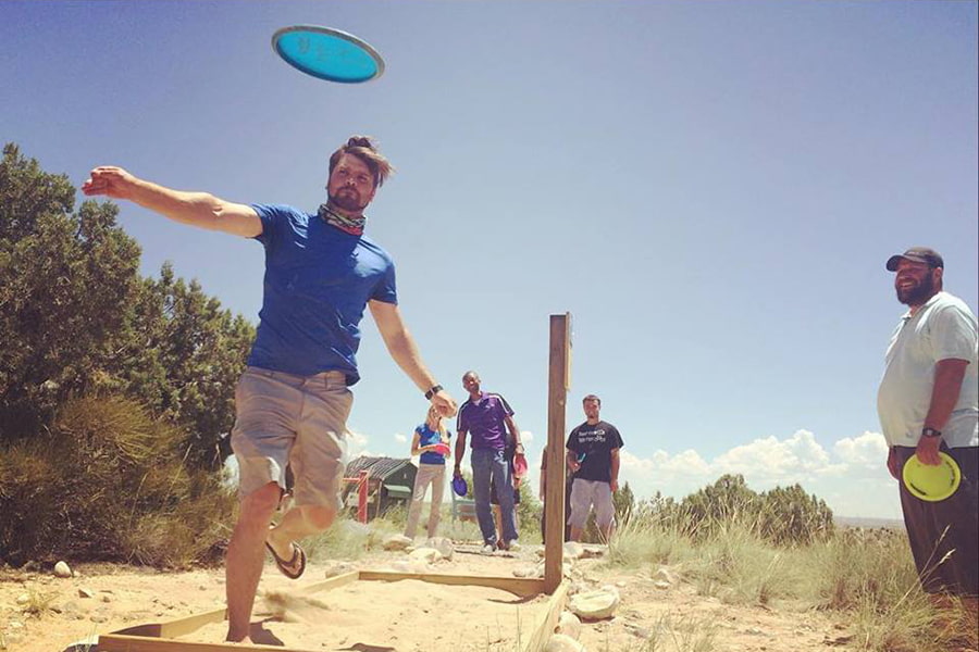 Individual throwing a Disc