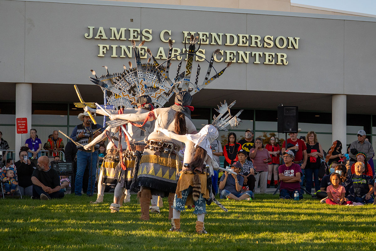 Dancers performing in their traditional clothing at the San Juan College Balloon Glow