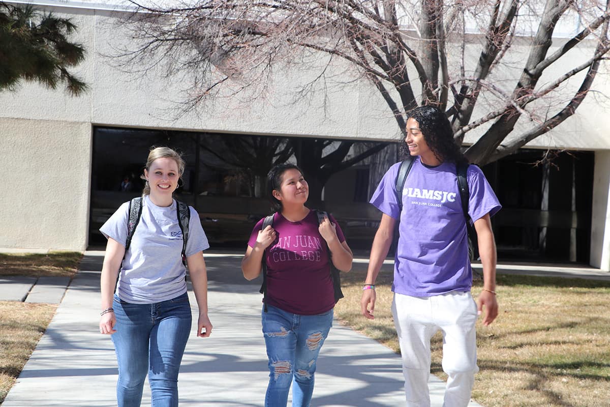 Three students walking on San Juan College campus.