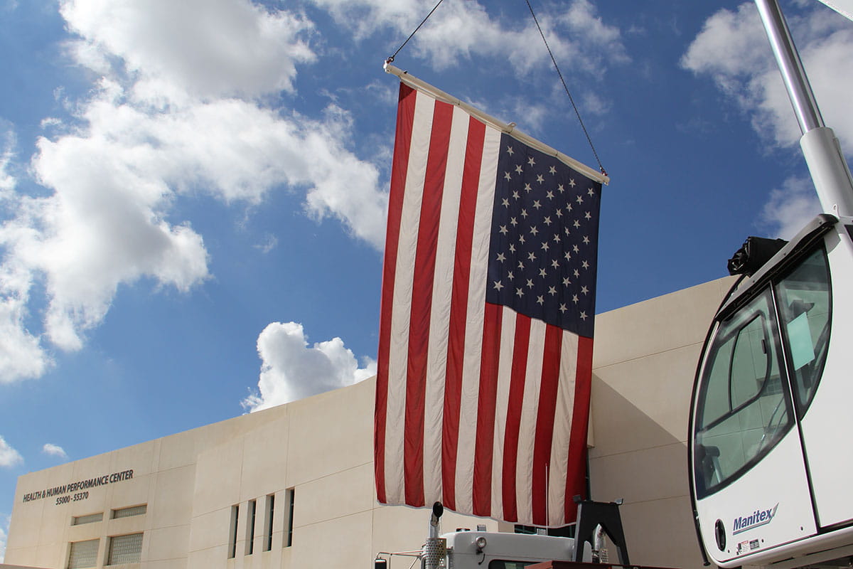 The American Flag hangs in front of the Health and Human Performance Center for SJCs Veterans Center Stand Down event in 2022