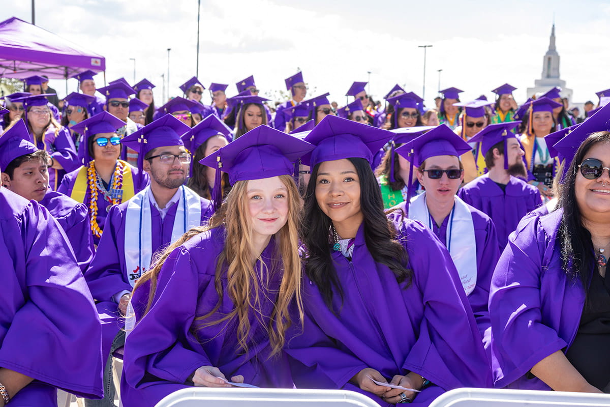 SJC Graduates in their gowns waiting to get their diplomas.