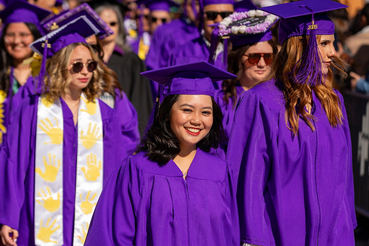 SJC Graduates in their gowns waiting to get their diplomas.